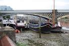 Boats by the eastern span of Battersea Railway Bridge - via Daymix