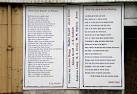 Large white boards bearing verses from famous local poets, - via Daymix