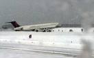 Plane Skids Off Runway in Snowstorm, Shuts New Yorks LaGuardia.