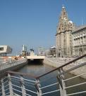 the city's South Docks, passing Pier Head and the famous Three Graces. - via Daymix