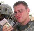 Lt. Brian Reynolds, an officer with the 101st Airborne in Iraq last summer, - reynolds_money_iraq