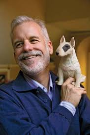 Photograph:Chris Van Allsburg holds a model of the bull terrier dog that appears in View full-size image. Chris Van Allsburg holds a model of the bull ... - 159758-004-B2511B76