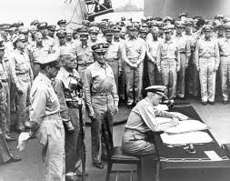 Admiral Nimitz signing the peace treaty on the Missouri