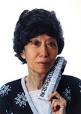 74-year-old Eileen Chang holding a newspaper which reports the death of Kim