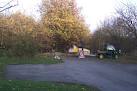 The yellow machine is a shredder, chopping the tree branches into mulch to - via Daymix