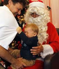 SCARY HAIRY MAN: One-year-old Christopher John Geen, of Atawhai, clings to his dad, Christopher Geen, after his first introduction to Santa at Fashion ... - 6115617