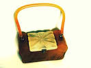 http://www.vintagefangirl.com/wp-content/uploads/vintage-bakelite-lucite-purse.jpg