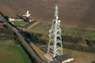 Aerial photo of transmitter and windmill. - via Daymix