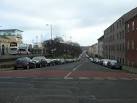 Bland modern apartment blocks stand on the former site of the Holyrood - via Daymix