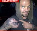 http://ll-media.tmz.com/2011/07/30/0730-bam-tattoo-exp.jpg