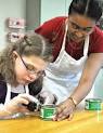 A teacher guides a student