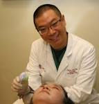 Dr. Calvin Lee performing a chemical peel procedure. - obagi-blue-peel-radiance-modesto-dr-lee-holding-fan