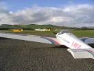 A Motor Falke motor glider in the foreground with towing aircraft beyond (2 - via Daymix