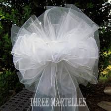 Pictures of non-classic tulle pew bows? :  wedding Images?q=tbn:ANd9GcT5B9oydkx4z DNs8H1CTANii80pOTod9YXPmhTkwl8aZ9N1abweg