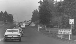 A caravan of law enforcement vehicles and members of the news media pursue Robert and Ila Faye Dent and hostage James Kenneth Crone, May 2, 1969. - DentChase2