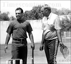 Cricketer Venkat Sundaram giving cricketing tips to batsman Ajay Sharma (left) in New Delhi - Venkat-Sundaram-Ajay-Sharma