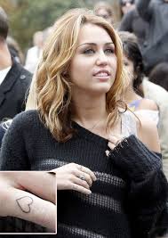miley cyrus tattoos and meanings