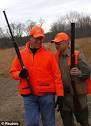 Republican candidate Rick Santorum, complete with NRA baseball cap ...
