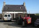 A Little Red Fergie. One of the iconic tractors outside the Cross Inn at - via Daymix