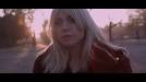 A girl relives the night before as she makes her way through North London at