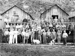 P.B. Anderson logging crew on the front steps of the camp bunkhouse likely at the Knox Bay camp on Thurlow Island. Charlie Mould is second from left in ... - 1283443413