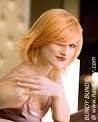 Strawberry blonde hair cut into a simple bob with box layers