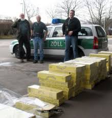 Customs officials inspect a stash of contraband Jin Ling cartons in Germany. Last year, 258 million Jin Ling cigarettes were seized throughout the European ... - mtbs_customs