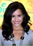 Demi Lovato looks over her shoulder as she arrives at the Disney and ABC ... - images?q=tbn:ANd9GcTRuO8NsaB3ass4wgjb411DVNG1QxTtnjlT7CLFBp_s3D79mIS6t2VrfVsO