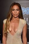 JENNIFER LOPEZ bares her cleavage in plunging jumpsuit at People.
