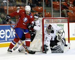 Anders Bastiansen #20 of Norway skates with the puck being follwed by Rodrigo Lavins #2 of Latvia during the IIHF World Ice Hockey Championship ... - 2008+IIHF+World+Ice+Hockey+Championship+Day+0lAJN8Uj4oMl