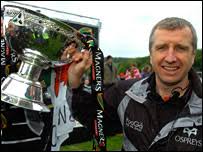 Ex-Ospreys coach Lyn Jones. Jones brought two league titles and the EDF Cup to Swansea - _44663916_lyn_jones_trophy203