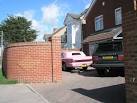 Pink cadillac in London Road driveway - via Daymix