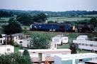 SJ5884 : Freight train passes the Caravan Park Nr Moore - via Daymix