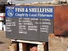 Sidmouth fishermen advertise their catch. A blackboard by the fishermen's - via Daymix