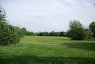 This play area is set within a large grass area and has both toddler and - via Daymix