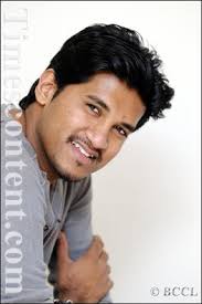 Tamil singer Vijay Yesudas poses for the Times of India photographer during a photo session, - Vijay-Yesudas