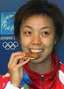 People's Daily Online -- Zhang Yining crowned Olympic table tennis ...