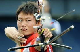 Archer Jiang Lin of China shoots an arrow during the men\u0026#39;s team archery competition of the Beijing Olympic Games in Beijing on August 11, 2008. - Archer-Jiang-Lin-of-China-shoots-an-arrow-