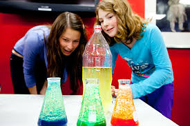 Andrea Henricks \u0026#39;13 (left), a mentor at the Harvard Allston Education Portal, and 10-year-old Nora Lyons made lava lamps, which they presented at a Student ... - 121111_showcase_074_605