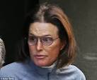 BRUCE JENNER leaves a clinic with a bandaged throat after.