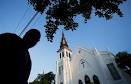 Latest on church shooting: Black, white pastors get tog.