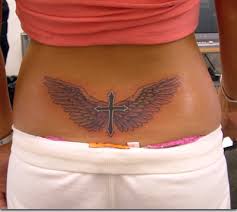cross wings lowerback tattoo