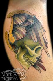 skull wing tattoo