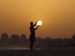 Man Holding Sun