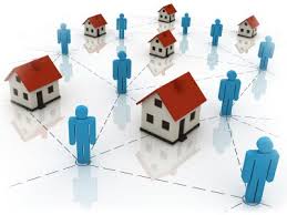 Several small houses with red roofs connected with blue dotted lines to blue figures. Are you looking to learn more about the concept of provider network?