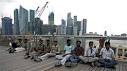 Singapore aims to stem rise in foreign workers, help poor | Reuters