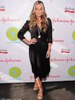 Molly Sims is a model mother as makes a stylish appearance with