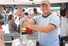 A new vendor this year, Clint Bissell at “Liquid Sunshine” squeezes up a fresh strawberry lemonade. - 2-5-MontaFARM-Squeezer