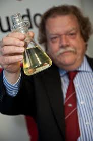 Caption: Murdoch University Professor Michael Borowitzka holds clean biofuel produced from algae. Credit: Murdoch University. - 18058_web