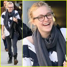 Earlier in the day, the 15-year-old New Moon actress worked out with one of the Garcia daughters, Alessandra Garcia-Lorido. - dakota-fanning-giggles-garcia